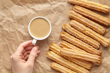 Wall Mural - churros traditional homemade spain breakfast or lunch meal street fast food baked sweet dough snack 