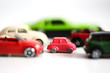 Traffic jam concept or advantages of small cars with multiple toy cars on white background
