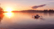 © marmoset - Romantic golden sunset river lake fog loving couple small rowing boat date beautiful Lovers ride during Happy woman man together relaxing water nature around