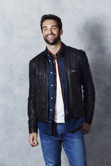 Wall Mural - Happy dude in leather jacket and jeans, portrait