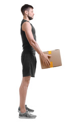 Wall Mural - Posture concept. Man lifting heavy cardboard box against white background