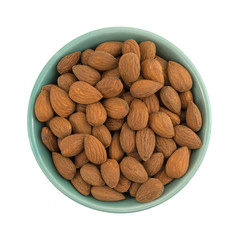 Wall Mural - Raw natural almonds in a bowl isolated on a white background.