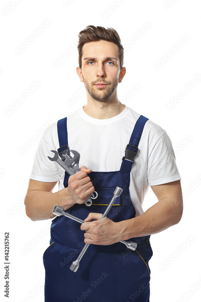 Handsome auto mechanic on white background