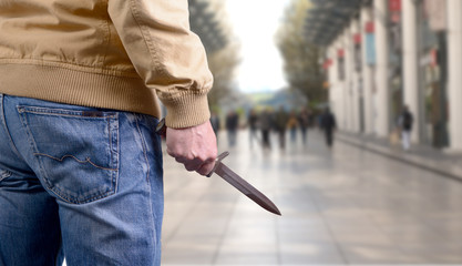 killer attacking with knife on public place