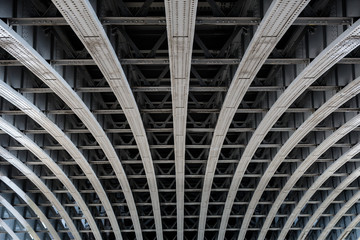 Parallel steel beams supporting bridge span