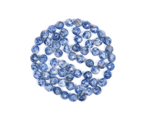 Wall Mural - Faceted round beads of blue and white sodalite from Africa isolated on white background