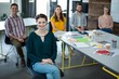 © WavebreakMediaMicro - Smiling graphic designers sitting in office