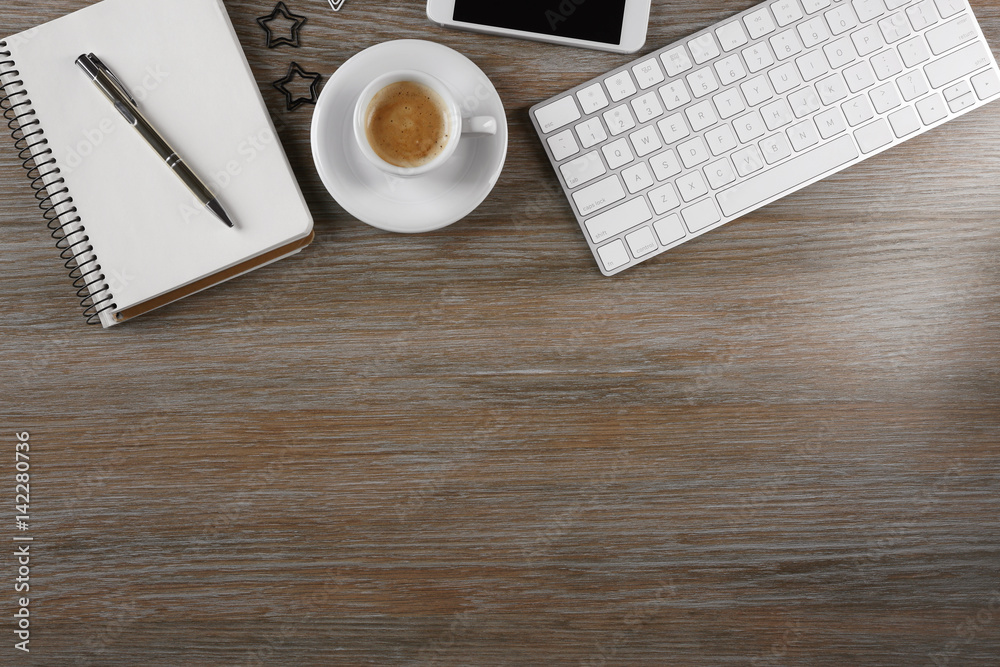 Modern workplace with cup of coffee