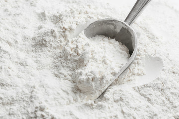 Sticker - Metal scoop in flour, closeup