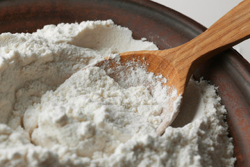 Sticker - Wooden spoon in flour, closeup