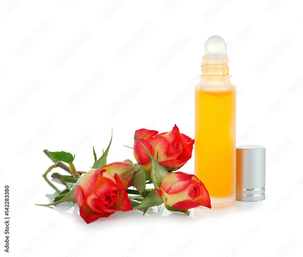 Bottle with perfume and rosebuds on white background