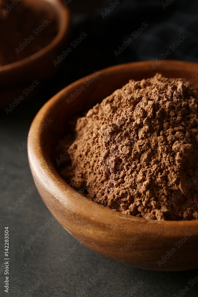 Bowl with cocoa powder, closeup