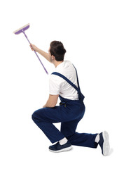 Wall Mural - Young window cleaner on white background