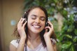 © WavebreakMediaMicro - Female listening to music on headphones