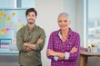 © WavebreakMediaMicro - Portrait of business executives standing with arms crossed