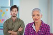 © WavebreakMediaMicro - Portrait of business executives standing with arms crossed