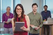 © WavebreakMediaMicro - Portrait of business executives using digital tablet