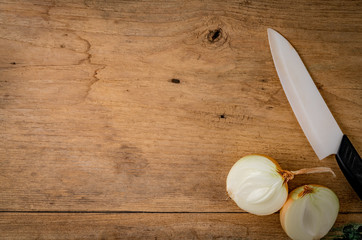 Wall Mural - Onion on brown wood