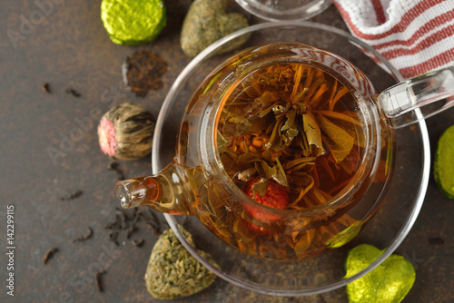 Fototapeta na drzwi i meble Flowering tea in a glass teapot