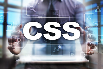 Businessman using tablet pc and selecting css.
