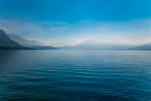 Fog On Mountains At Annecy Lake In France