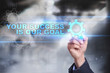 © WrightStudio - Businessman is drawing on virtual screen. your success is our goal concept.