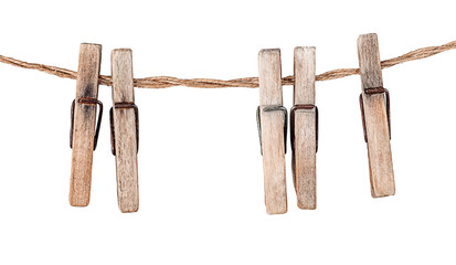 Five old clothespins on rope