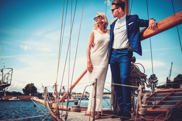 Wall Mural - Stylish wealthy couple on a luxury yacht