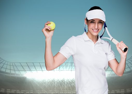 Tennis player against stadium with bright lights and blue sky