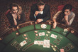 © Nejron Photo - Upper class friends gambling in a casino