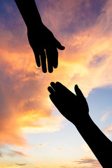 helping hand with the sky sunset background