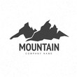 Mountains logo template with abstract peaks background. Mountain monochrome abstract background. Mountaineering and Traveling icon.