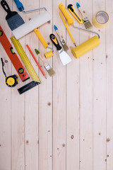 Wall Mural - Top view of set of construction tools on wooden table