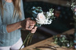 © cherry_d - Florist at work: pretty young blond woman holds fashion modern bouquet of different flowersv