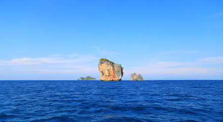 Thailand summer travel sea, Mountain at sea beach Krabi Phi Phi Island Phuket park on white sand blue sky emerald green ocean water. space for texture