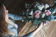 © cherry_d - Florist at work: pretty young blond woman holds fashion modern bouquet of different flowers