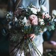 © cherry_d - Florist at work: pretty young blond woman holds fashion modern bouquet of different flowers