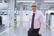 © Westend61 - Portrait of a manager on shop floor of a factory