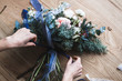 © cherry_d - Florist at work: pretty young blond woman holds fashion modern bouquet of different flowers