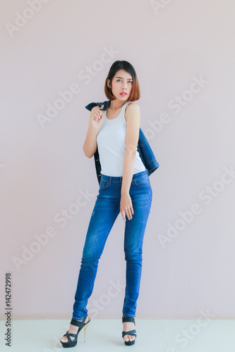 Asian Woman Casual Outfits Standing In Jeans And Blue Denim Shirt