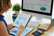 © DragonImages - Analyzing charts and graphs