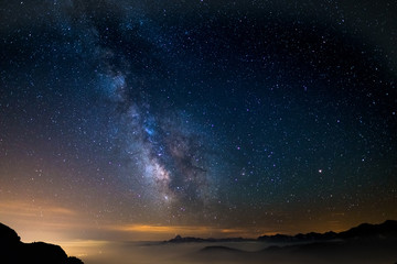 Wall Mural - the outstanding beauty of the milky way arc and the starry sky reflected on lake at high altitude on