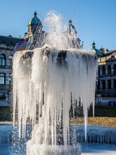 Frozen Fountain On The Lawn In Front Of A Parlament Building, Victoria BC