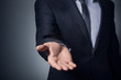 © drouk - An empty workpiece.  A gesture expressing help, holding out a hand. Businessman stretches out his hand.