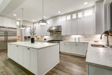 Wall Mural - Gourmet kitchen features white cabinetry