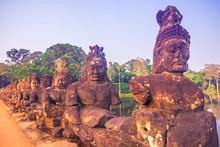 October 11, 2014: Statues In The Entrance To The Ancient City Of Bayon In The Angkor Wat Temple Complex Near Siem Reap, Cambodia
