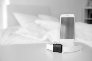 Wall Mural - Mobile phone and sleep tracker on table in bedroom