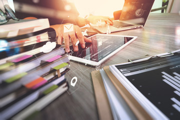 Aufkleber - businessman working with laptop computer and digital tablet and book and document on wooden desk in modern office with virtual icons interface