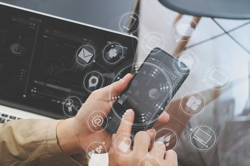 Poster - hand using smart phone and digital tablet computer for online banking payment communication in modern office with virtual computer interface graphic and icons diagram