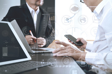 co working team meeting concept,businessman using smart phone and digital tablet and laptop computer in modern office